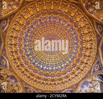 Intricate patterned ceiling in Tilla Kari Madrasah in Uzbekistan Stock Photo