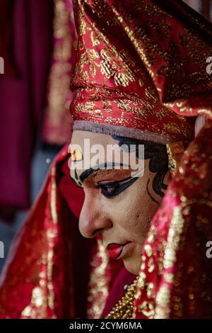 Munnar, India, Mar 11, 2018 - Traditional Indian dancer adjusts his costume prior to show Stock Photo