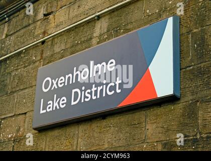 Station nameboard. Oxenholme Lake District rail station, West Coast Main Line, Cumbria, England, United Kingdom, Europe. Stock Photo