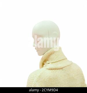 White female mannequin in light knitted sweater on isolated background Stock Photo