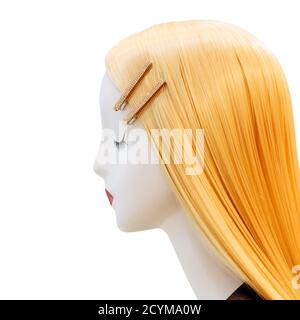 Profile of female mannequin with blond hair on isolated background Stock Photo