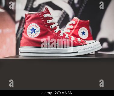 Rosefarve flyde oprindelse Converse shoes on display. They are an American shoe company that designs  and produces sneakers that are cool, grungy popular with the youth culture  Stock Photo - Alamy