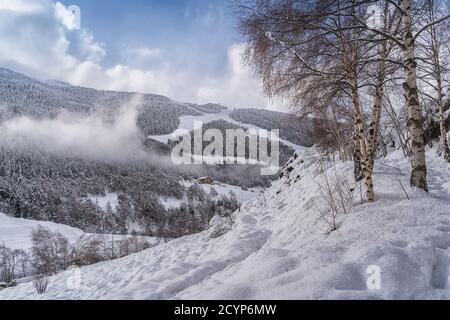 Aerial view the Pyrenees Mountains in Andorra , Grandvalira ski area in El Tarter one winter day . Stock Photo