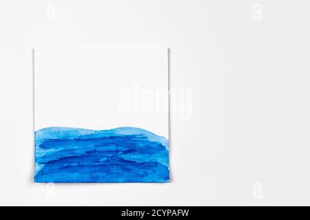 Watercolor hand painted waves illustration on the paper with copy space. Concept for the design with photo watercolor paper texture Stock Photo