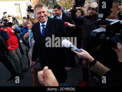 A supporter gives a thumbs-up to presidential candidate Klaus Iohannis, an ethnic German mayor backed by two center-right parties, as he leaves a polling station in Sibiu November 16, 2014. Prime Minister Victor Ponta looks set to become Romania's youngest president in a runoff vote on Sunday, a result that could make one of Europe's poorest nations more stable as it looks to exit an IMF-led aid deal. Backed by a well-oiled party machine, Ponta has led opinion polls and comfortably beat his nearest challenger, ethnic German mayor Klaus Iohannis, in the first round election on Nov 2.   REUTERS/