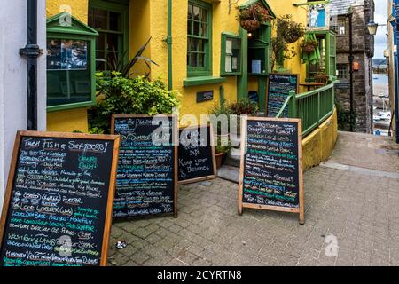 Chalk board menus outside the Plantagenet House restaurant in Tenby,  Pembrokeshire Coast National Park, Pembrokeshire, Wales Stock Photo