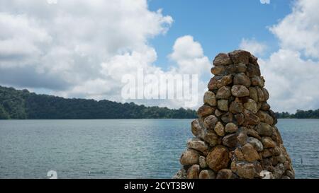 View of a Hindu temple building on the edge of a lake in Bali, Indonesia Stock Photo