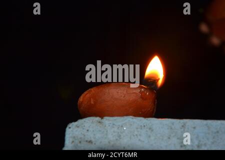 Oil lamps with flame. deepawali or diwali is celebrated by hindus by lighting the oil lamps. Stock Photo