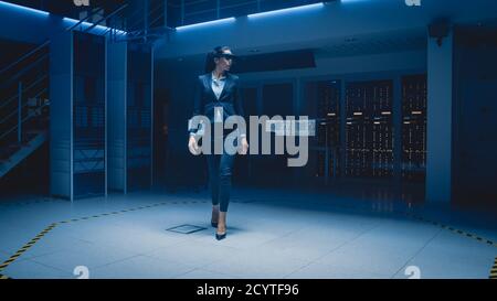 In 3D Content Creating Laboratory Stylish and Beautiful Female Engineer Wearing Professional Virtual Reality Headset Works and Gestures in Augmented Stock Photo