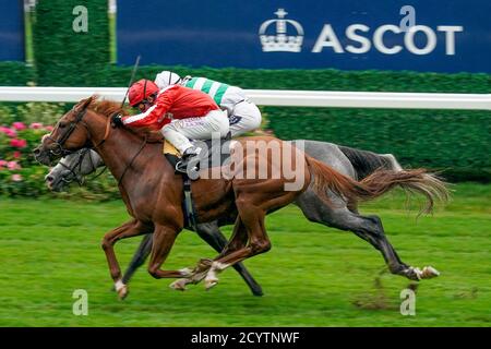 Oisin Murphy riding Berkshire Rocco (red) wins The TeenTech Noel Murless Stakes from Harry Bentley and Albaflora (farside) at Ascot Racecourse, Ascot. Stock Photo