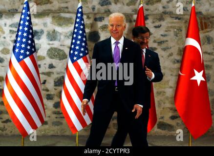 U.S. Vice President Joe Biden (L) and Turkey's Prime Minister Ahmet Davutoglu arrive at their meeting in Istanbul November 21, 2014. Turkey and the United States played down differences in the fight against Islamic State on Friday, but Prime Minister Ahmet Davutoglu made clear Ankara would keep pressing for a no-fly zone in Syria and President Bashar al-Assad's removal. REUTERS/Murad Sezer (TURKEY - Tags: POLITICS)
