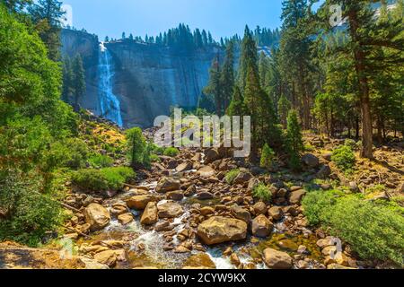 bottom view of Nevada Fall waterfall from Mist Trail in Yosemite National Park. Summer travel holidays in California, United States of America.