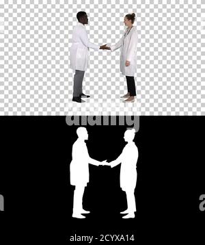 Successful team of surgeons giving high five and laughing isolat Stock Photo