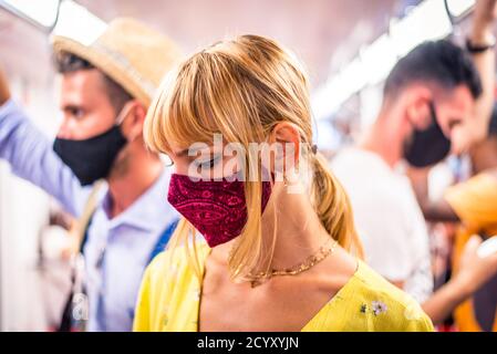 Beautiful girl driving on a subway wagon during covid-19 pandemic, concepts about lifestyle, trasportation and social distancing Stock Photo