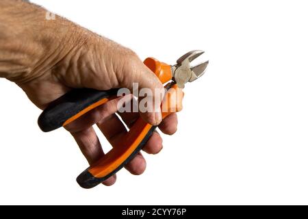 Hand holding wire cutters isolated against white background Stock Photo