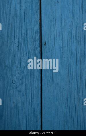 Closeup of weathered wooden door painted in dark blue Stock Photo