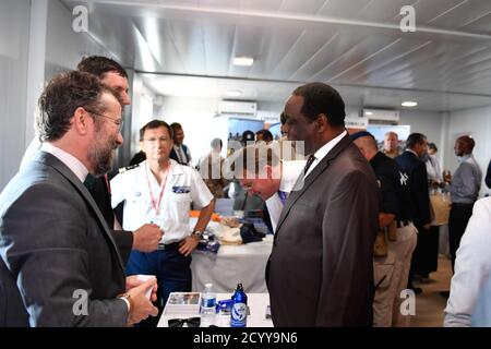 The Special Representative of the Chairperson of the African Union Commission (SRCC) for Somalia, Ambassador Francisco Caetano Madeira (right) inspects exhibition stalls during celebrations to mark Europe Day in Mogadishu, Somalia on May 02, 2019. Stock Photo