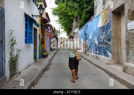 Man with multiple use face mask from behind during the covid-19 quarantine in Cartagena, Colombia. 2020 Stock Photo