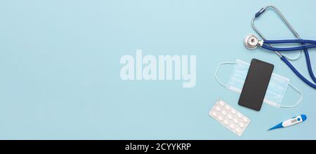 Medical items, healthcare, image with copy space on blue background. Stock Photo