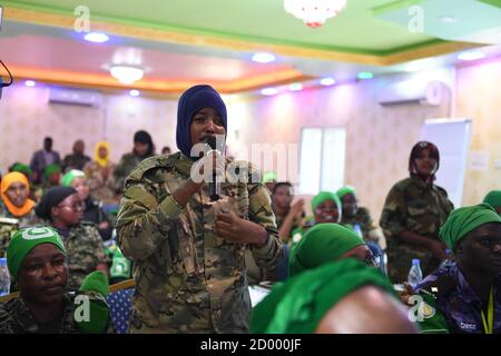 A female soldier of the Somali National Army (SNA) sings during a one-day workshop on empowering female peacekeepers organised by AMISOM's Human Rights, Protection and Gender Unit in Mogadishu on 24 October 2019. Stock Photo