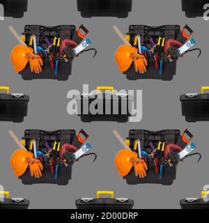 seamless pattern of plastic tool box with an orange construction protective helmet and various hand tools isolated on a grey backgroun close up Stock Photo