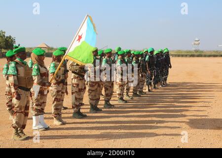 AMISOM soldiers in Beletweyne, Somalia, line up in a guard of honour for outgoing AMISOM Sector Four Commander, Col. Mohamed Ibrahim Moussa on 16 February 2020. Stock Photo