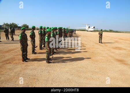 AMISOM soldiers in Beletweyne, Somalia, line up in a guard of honour for outgoing AMISOM Sector Four Commander, Col. Mohamed Ibrahim Moussa on 16 February 2020. Stock Photo