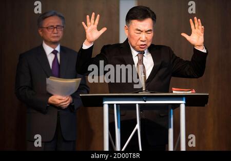 Reverend Suh Inkoo (R) from Somang Church speaks in front of Choong Sik Ryu (L), Chairman of the Council of Korean Churches in Ontario during a prayer service for Reverend Hyeon Soo Lim, inside a chapel at the Light Korean Presbyterian Church in Mississauga, March 9, 2015. The Rev. Hyeon Soo Lim, 60, the leader of the 3,000-member Light Korean Presbyterian Church in suburban Toronto, was last heard from on Jan. 31 and is believed to be the Canadian who diplomats have confirmed is being detained by North Korean authorities.    REUTERS/Mark Blinch (CANADA - Tags: POLITICS RELIGION)