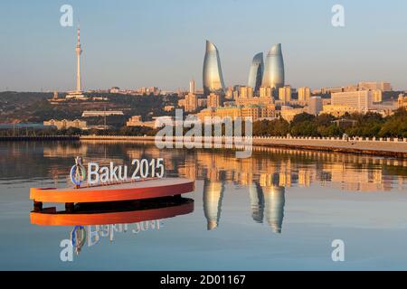 Baku Bay and the Baku skyline at dawn. The sign is to highlight the European games held in Baku in June 2015. Stock Photo