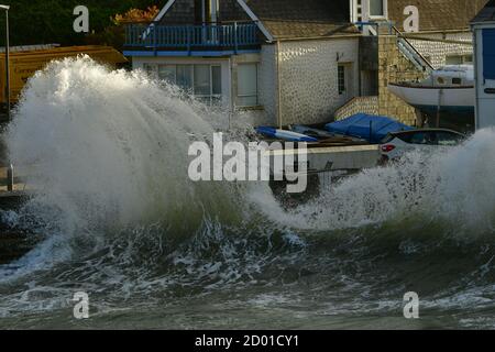 Portmellon, Cornwall. 2nd October 2020. UK Weather. Storm Alex ,Huge Storm force Waves batter houses on the front at Portmellon village ,people were unable to leave their houses in Cornwall Friday afternoon. Picture Credit Robert Timoney/Alamy/Live/News Stock Photo