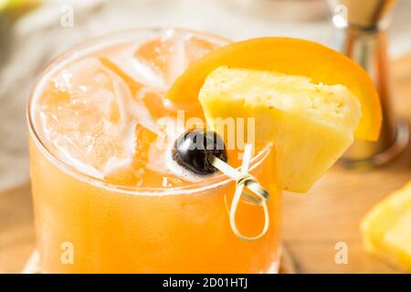 Refreshing Boozy Rum Runner Cocktail with PIneapple and Orange Stock Photo