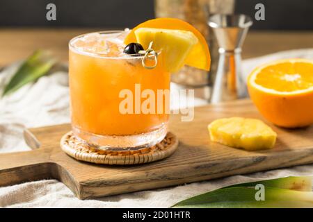 Refreshing Boozy Rum Runner Cocktail with PIneapple and Orange Stock Photo