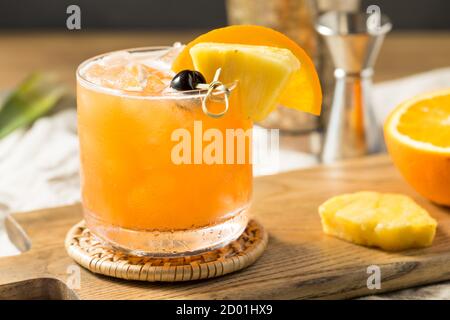 Refreshing Boozy Rum Runner Cocktail with PIneapple and Orange Stock Photo