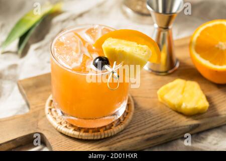 Refreshing Boozy Rum Runner Cocktail with PIneapple and Orange Stock Photo