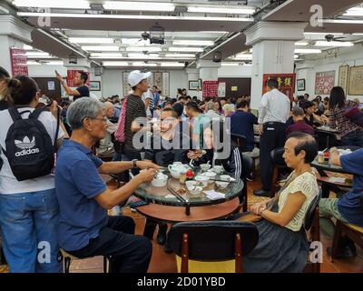 The interior of a traditional old style Dim Sum restaurant in Hong Kong which is fast disappearing of has already done so. Stock Photo