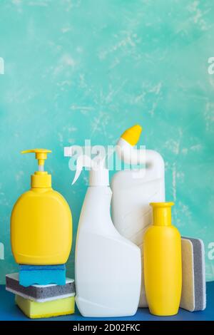 Professional cleaning equipment on blue background overview. Cleaning tools concept. composition with Plastic detergent bottles. House cleaning Stock Photo