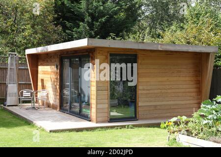 Working from home, Luxury Wooden Outdoor Garden Office or Studio in UK garden, Surrey, UK, August 2020 Stock Photo