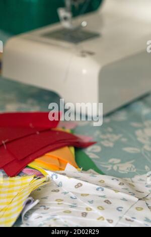 Close up of a sewing machine on a tabletop Stock Photo