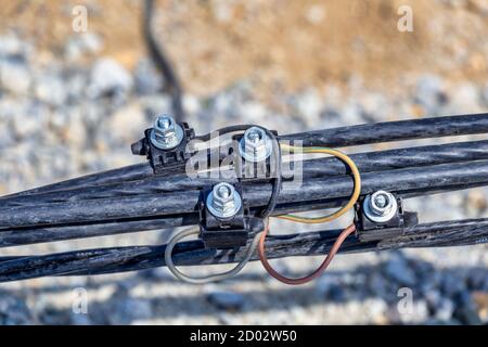 Connect electrical wires at the construction site. Electrical wire splicing. Stock Photo