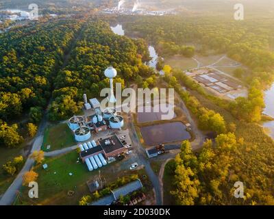 Top aerial view of purification water tanks of modern wastewater treatment processing plant Stock Photo
