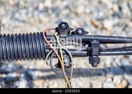 Electrical wire splicing, connect electrical wires at the construction site. Stock Photo