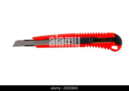 Red clerical knife or stationery knife top view isolated on white background. Stock Photo