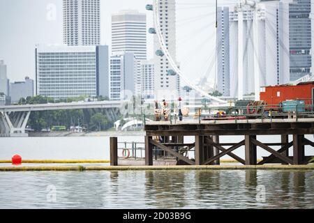 Some workers are working on a bridge in Singapore during the Covid-19 outbreak. Stock Photo