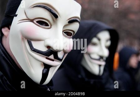 Protestors wearing Guy Fawkes masks participate in a demonstration against the Anti-Counterfeiting Trade Agreement (ACTA) in Berlin February 25, 2012. Protesters fear that ACTA, which aims to cut trademark theft and other online piracy, will curtail freedom of expression, curb their freedom to download movies and music for free and encourage Internet surveillance. REUTERS/Tobias Schwarz (GERMANY - Tags: POLITICS CIVIL UNREST)