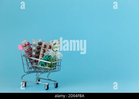 medicines in a shopping cart. The concept of buying medicines on the Internet, online, on the site, remotely Stock Photo