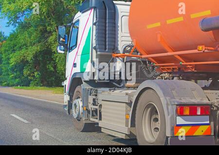 big gas-tank truck goes on highway Stock Photo