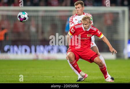Berlin, Germany. 02nd Oct, 2020. Football: Bundesliga, 1st FC Union Berlin - FSV Mainz 05, 3rd matchday, Stadion An der Alten Försterei. Luca Kilian (l) of FSV Mainz fights for the ball against Berlin's newcomer Joel Pohjanpalo. Credit: Andreas Gora/dpa - IMPORTANT NOTE: In accordance with the regulations of the DFL Deutsche Fußball Liga and the DFB Deutscher Fußball-Bund, it is prohibited to exploit or have exploited in the stadium and/or from the game taken photographs in the form of sequence images and/or video-like photo series./dpa/Alamy Live News Stock Photo
