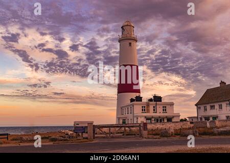 Portland, United Kingdom - 18 July 2020: Amazing capture of Portland Lighthouse with beautiful sky cloud cast during early sunset, dramatic sky over a Stock Photo