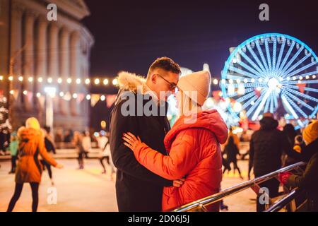 Ice skating together. Romantic winter vacation in ice arena. Young couple skating at ice rink. Best Christmas ever. Winter fun. Cute Valentine's Day Stock Photo