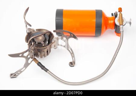 gas and petrol tourist burner on a white background. items for tourism and survival. Cooking. Stock Photo